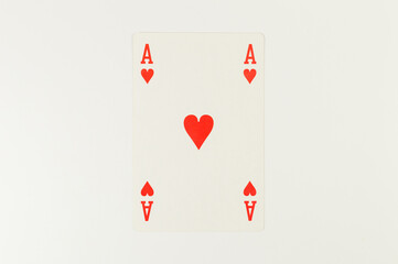 Top view of playing cards on white background. One ace card, board game, poker. Copy space, flat lay.