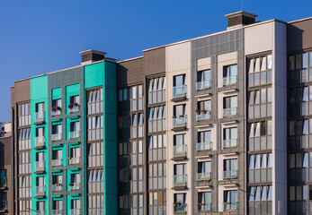 Fototapeta premium City view on a sunny day. Modern buildings, walls and windows. 