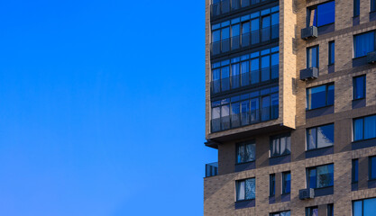 Cityscape on a summer day, modern buildings and houses 