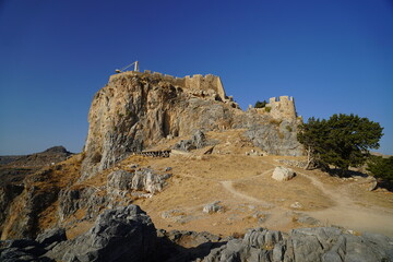 Fototapeta premium steep cliffs surrounding the acropolis of Lindos 