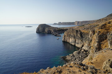 steep cliffs surrounding the acropolis of Lindos 