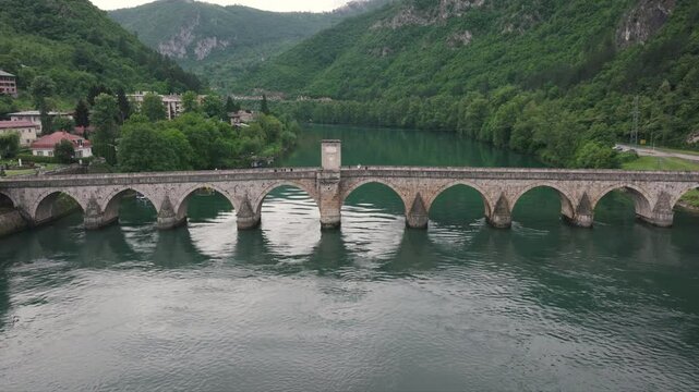 Beautiful 4k aerial drone video of Mehmed Pasa Sokolovic bridge in town Visegrad, landmark from 16th century, Visegrad, Republic of Serbia, Bosnia and Hercegovina 2024.