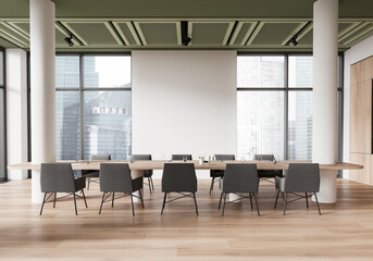 Modern conference room interior with large wooden table and grey chairs in front of floor-to-ceiling windows overlooking cityscape. 3D Rendering