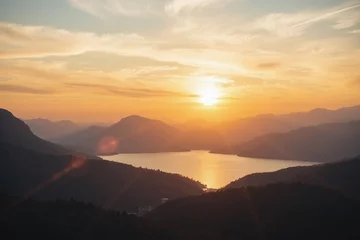 Gordijnen Sunset sunrise landscape tranquil lake sea hills mountains sky colors © He