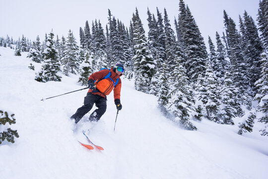 Backcountry skier making turns on the Musical Bumps, Whistler.