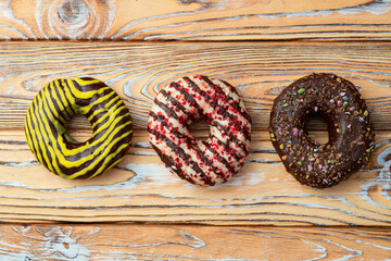 Sweet glazed colorful donuts . Top view