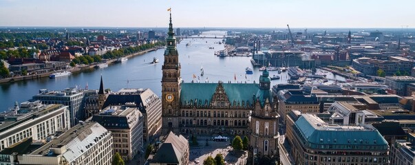 Naklejka premium A panoramic view of Hamburg featuring the iconic city hall, the picturesque river, and vibrant urban architecture under clear skies.