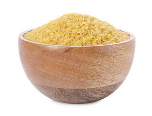 Raw bulgur in wooden bowl isolated on white