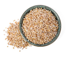 Dry wheat groats in bowl isolated on white, top view
