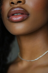 A close up of a woman wearing a pearl necklace