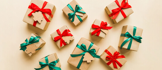 Colored craft gift boxes with colorful ribbons on colored background. Collection of Christmas...