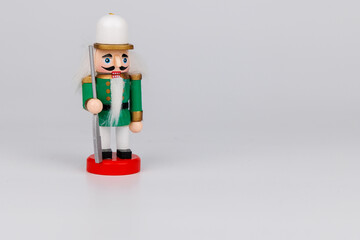 Festively Adorned Wooden Nutcracker with Original Hair on White Canvas