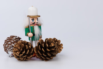 Whimsical Nutcracker Surrounded by Pine Cones for Holiday Cheer