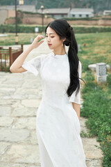 Fototapeta premium Asian women wearing cheongsam at the film and television base