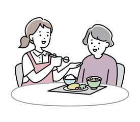 食事介助をする介護士とおばあさんのイラスト素材