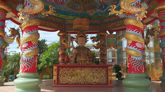 Buddha statue in a Chinese buddhist temple . Thepsathit Phra Kiti Chalerm Chinese shrine. Bang Saen, Chonburi Thailand Southeast Asia