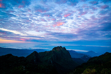 Breathtaking sunrise over mountain peaks nature landscape cloudy skies tranquil environment...