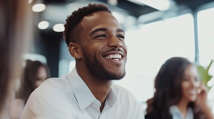 Smiling man enjoying social gathering in a modern cafe during daytime with friends