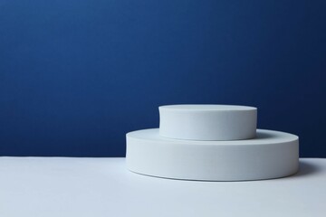 White podiums on two-tone background 