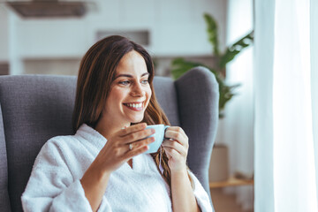 Relaxed Woman in Bathrobe Enjoying Morning Coffee at Home