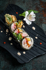 tasty sushi on the dark background