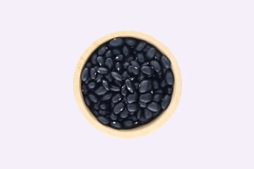 A pile of black beans, In a wooden bowl. Top view shows black beans in a wooden bowl isolated on white background.