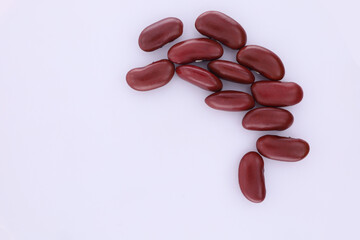 A pile of red beans flat lay on white background, Top view above shows red beans isolated on a white background.