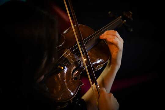 Closeup of hands playing violin