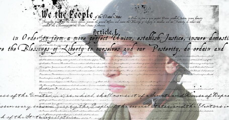 Constitution text image over close-up of person wearing military uniform