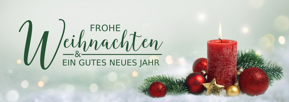 Christmas greeting card german text - Merry Christmas and happy new year - Xmas decoration with red candle - Winter background with snow and golden lights - Panorama, banner, header for advertisement 