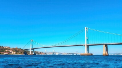 Obraz premium Iconic Bosphorus Bridge connecting Europe and Asia in Istanbul under clear blue sky, spanning, infrastructure