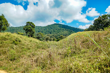 Nature landscape photography in mountainous region lush green hills with blue sky captivating viewpoint for outdoor enthusiasts