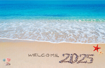 Welcome 2025 written on the sand