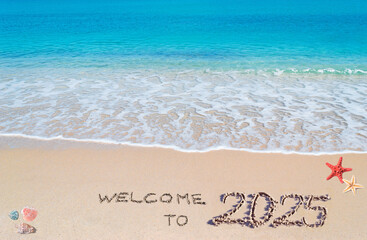 welcome to 2025 written in the sand