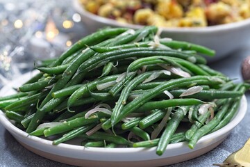 Haricot verts or French green beans with caramelized shallots, side dish, horizontal, closeup