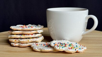 Cup of coffee with homemade Christmas cookies.