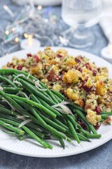 Green beans with caramelized shallots and Traditional Cranberry pecan cornbread dressing, vertical
