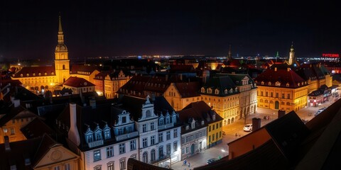 Fototapeta premium Panoramic view of illuminated old town buildings at night in Opole, Poland, lights, buildings