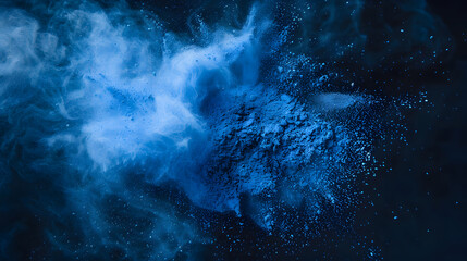 Obraz premium A burst of blue powder creating a dynamic, abstract visual effect against a dark background.