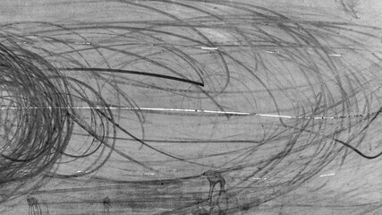 Tire mark from car skid mark, Car tire mark skid mark on asphalt road race track, Texture and background car wheel tire mark on asphalt road. © Kalyakan