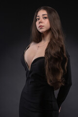 Fashion portrait of pretty woman in black dress