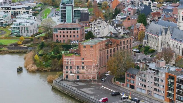 molens van temse historical building near river scheldt scene includes church surrounding village aerial drone shot belgium quay landmark residential area 