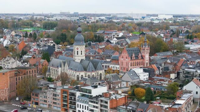 temse focuses church city hall middle town residential area river scheldt add to picturesque setting aerial belgium drone view cityscape riverfront scenic footage scene 