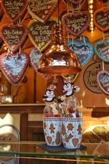 A stall with traditional German sweets. Heart-shaped gingerbread cookies at the Christmas market in Lübick.