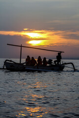 Fototapeta premium Serene Ocean Scenes: Balinese Jukung Boats at Dawn
