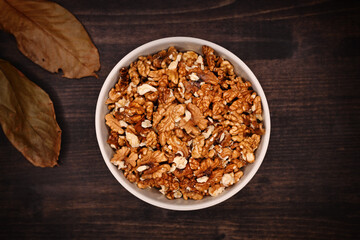Walnut kernels in a bowl on desk