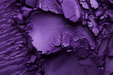 Obraz premium A close-up of textured purple material with cracks and layers.