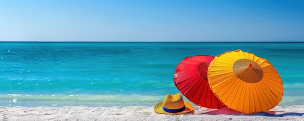 Vibrant Beach Umbrellas and Sun Hat Overlooking Tranquil Ocean.