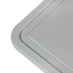 Chopping plastic cutting board corner white background. cutting board utensil