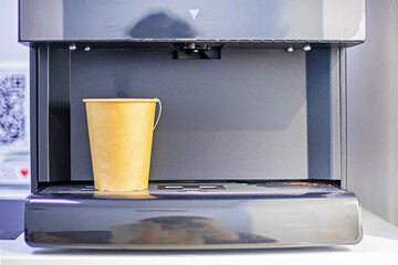 machine with disposable cardboard cup of secondary processing of green tea. Ecology of the environment